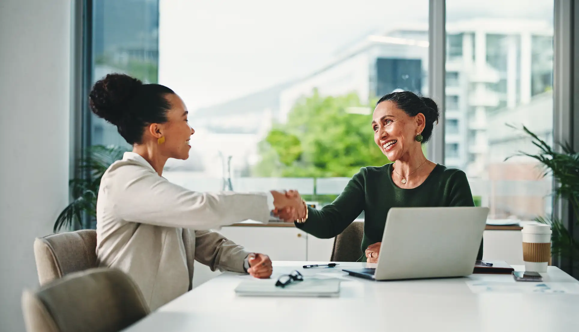 Two executives shaking hands
